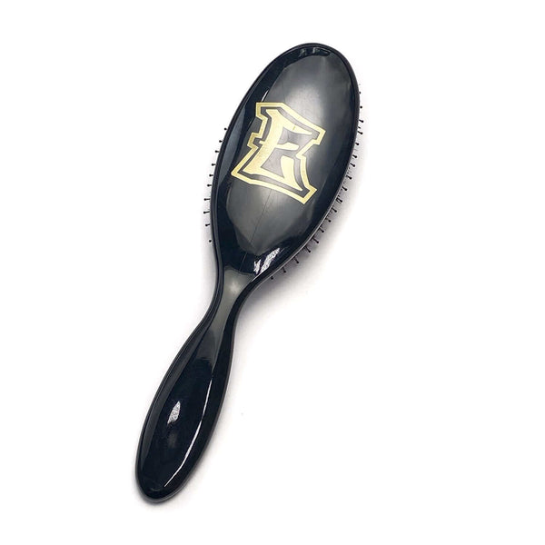 Black ELEVATE HAIR Cushion Brush by VESS with gold "E" logo, featuring heat-resistant nylon and boar bristles for smooth, shiny hair.