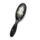 Black ELEVATE HAIR Cushion Brush by VESS with gold "E" logo, featuring heat-resistant nylon and boar bristles for smooth, shiny hair.