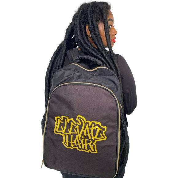 Woman wearing ElevateHair Stylist Backpack with adjustable padded shoulder straps and multiple pockets for hairstyling tools.