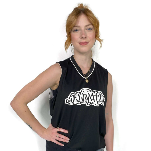Woman wearing ElevateHair Reversible Basketball Jersey in black with logo print, 100% polyester wicking knit, stylish and comfortable