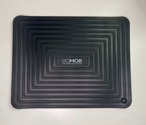VoMor Heat Mat for protecting surfaces from styling tools up to 500°F, featuring sleek black design.