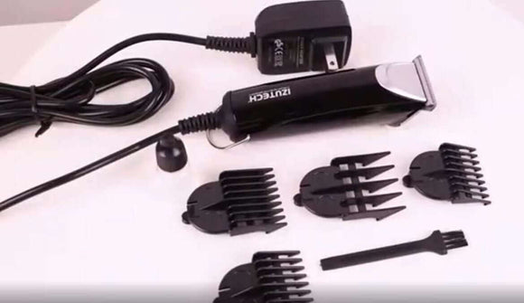 Izutech clipper and accessories from Aveda Arts 5-Piece Tool Set including various clipper guards and a cleaning brush.