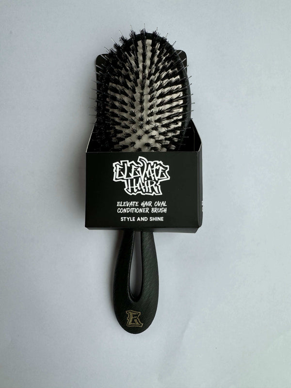 ELEVATE HAIR Cushion Brush by BASS with premium natural boar bristles and patented plant-based handle for styling and shine.